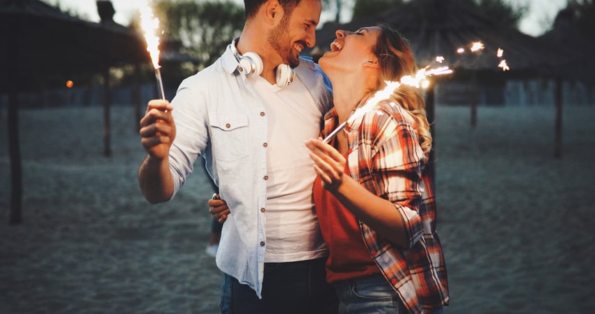 Two friends smiling into each others eyes